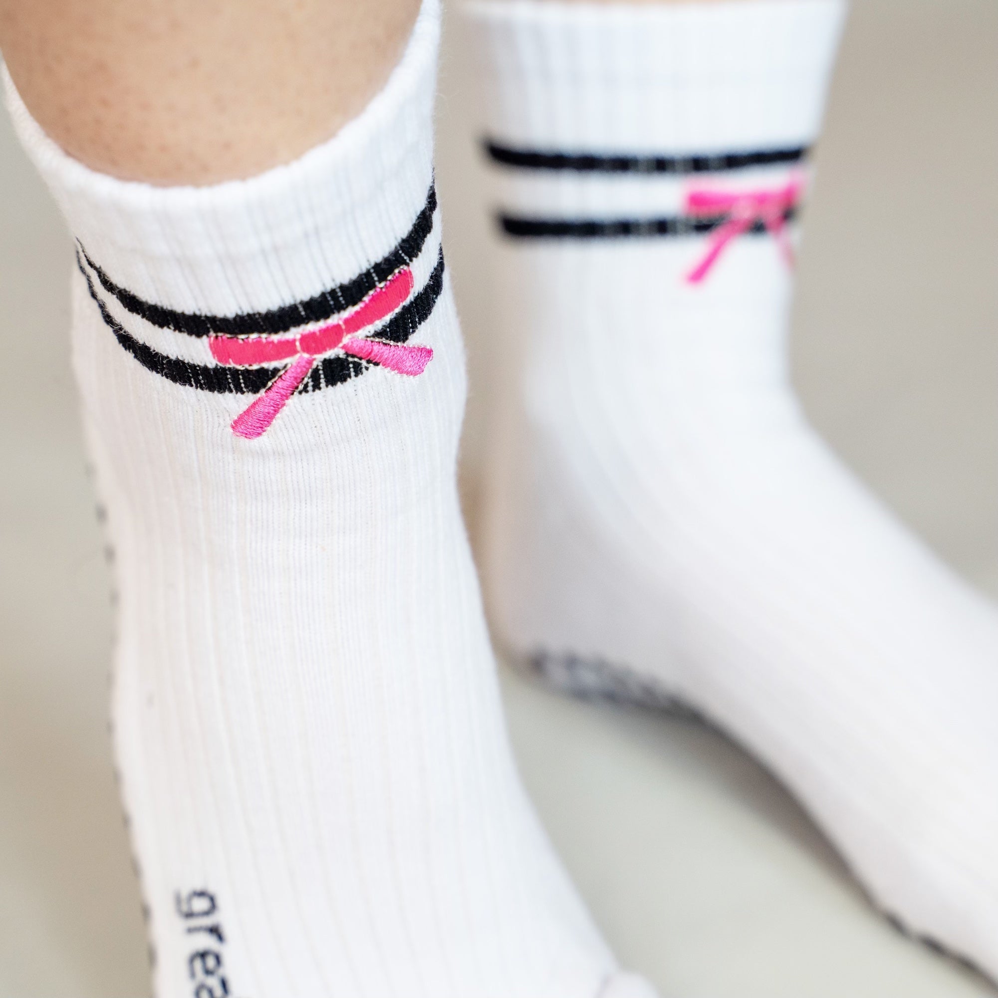 Greer crew grip sock in white, black, pink with a ribbon for pilates,barre and stretching
