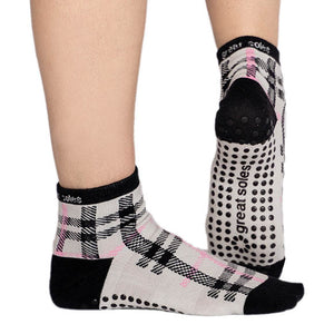 Emila a black grey plaid short crew grip sock wear this sock for pilates and barre and running